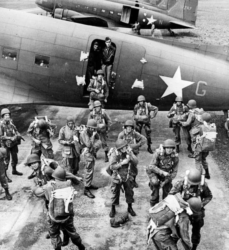 D-D parachute group near an airplane